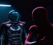a man in a spiderman suit is punching another man