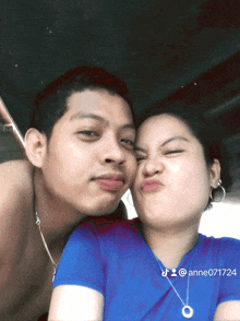 a man and a woman are posing for a picture with the number anne071724 on the bottom