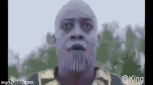 thanos is a bald man with a beard and a purple mask .