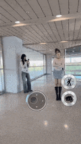 a woman standing in a hallway with her arms crossed and a circle with a fist on it