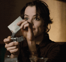 a woman is holding a piece of paper that says ' i 'm sorry ' on it