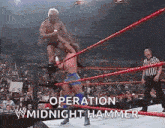 two men are wrestling in a wrestling ring with the words `` operation midnight hammer '' written above them .