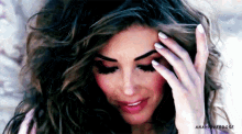 a close up of a woman 's face with the name anah overdose written below her