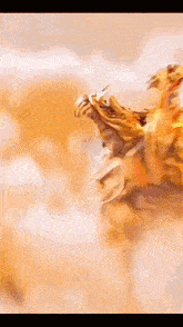 a close up of a statue of a dragon with a blurred background