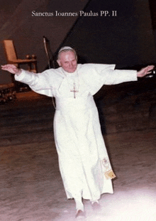 a man in a white robe is standing with his arms outstretched under the words sanctus joannes paulus