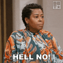 a woman in a floral shirt is saying hell no
