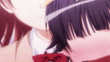 a girl in a red bow tie is kissing another girl