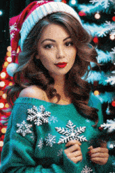 a woman wearing a santa hat is holding a snowflake ornament