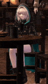 a girl in a hooded cape sits at a table in a video game