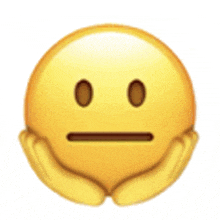 a yellow smiley face with a serious look on its face is being held in someone 's hands .
