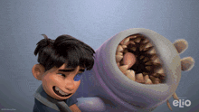 a boy is holding a stuffed animal with the word elio on the bottom
