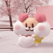 a stuffed animal with pink ears is holding a heart .