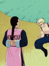 a man in a pink shirt that says kyoui