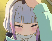 a close up of a person 's hand touching a girl 's hair
