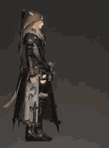 a person in armor is holding a large sword with a flame coming out of it .