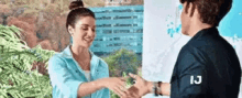 Isabela Souza Hand Shaking GIF - Isabela Souza Hand Shaking Smiling GIFs