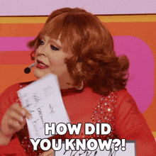 a woman with red hair is holding a piece of paper that says " how did you know "