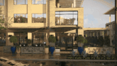 a large building with a lot of windows and potted plants outside