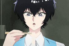 a woman with black hair and blue eyes is holding chopsticks to her mouth