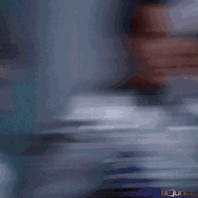 a blurry picture of a man 's face with the words bounce on the bottom right