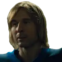 a close up of a man 's face with long blonde hair and a blue shirt