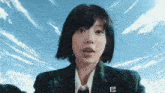 a woman in a plaid jacket has the letter b on her badge