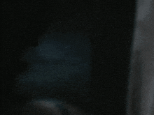 a dark background with a few white dots on it