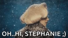 a woman in a leopard print coat is standing in the snow and says oh hi stephanie .