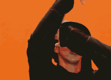 a young man wearing a hat with the word new york on it