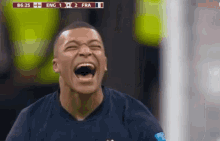 a soccer player is laughing in front of a scoreboard that says eng 1 2 fra 1