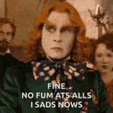 a man with red hair is wearing a green jacket and a bow tie .