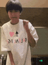 a person wearing a white t-shirt that says balenciaga