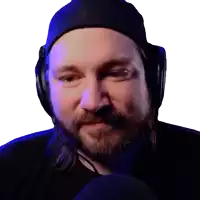 a man with a beard wears headphones and a hat