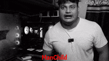 a man in a white shirt is standing in front of a manchild