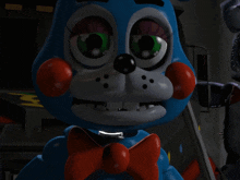 a close up of a toy with a bow tie on