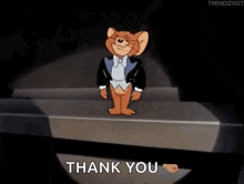 jerry from tom and jerry is wearing a tuxedo and bow tie and is standing on a stage .