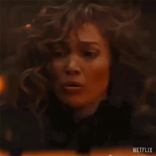 a woman with her hair blowing in the wind is saying what do i do ?