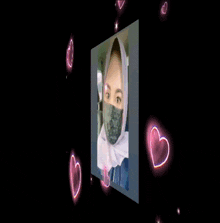 a woman wearing a mask is surrounded by hearts and the letter h