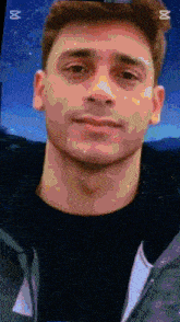 a close up of a man 's face with the letter m on the bottom left