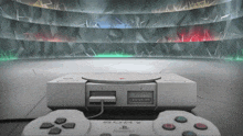 a sony video game console sits on a concrete floor
