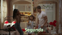 a man and two women are dancing in a room with the word segunda on the bottom right