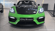 a green car with the word car street on the front of it