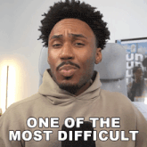 a man in a hoodie says one of the most difficult in white letters