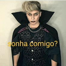 a man in a vampire costume with the words sonha comigo written below him