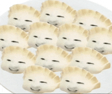 a plate of dumplings with a face on them