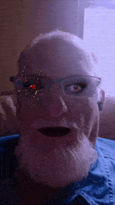 a man with glasses and a beard has a spider on his face