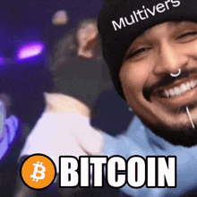 a man wearing a hat that says " multivers " is smiling and says " bitcoin "