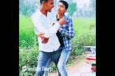 two young men standing next to each other in a field with youtube shorts on the bottom
