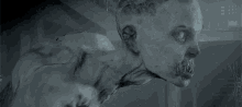 a close up of a monster with sharp teeth and long arms in a dark room .