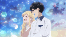 a boy and a girl are standing next to each other with bubbles surrounding them